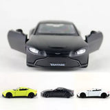 Black Aston Martin Vantage diecast toy car, front view with headlights and grille.