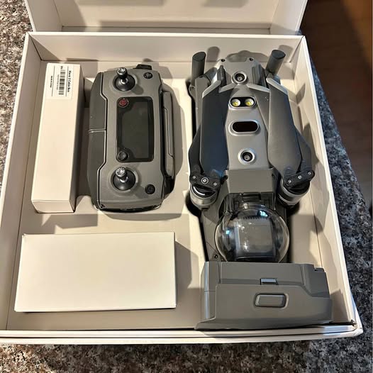 DJI Mavic 2 Pro drone with folded propellers and visible camera module, in box