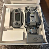 DJI Mavic 2 Pro drone with folded propellers and visible camera module, in box