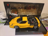 Ferrari Enzo yellow diecast car model in display case