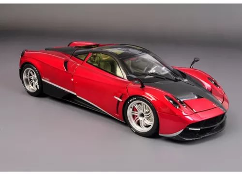 Red 1/18 scale diecast sports car model with black hood and silver wheels