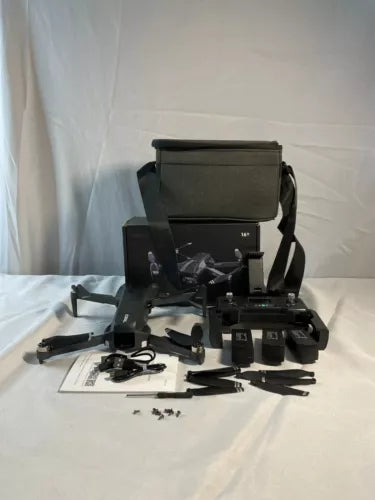 Black drone with remote controller and accessories kit