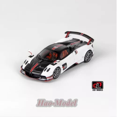 White and black alloy diecast model car with red accents, detailed front view