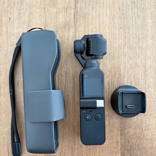 DJI Osmo Pocket gimbal camera with front screen, buttons, and blue case