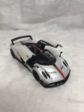 1:38 diecast model sports car in pearl white with black hood and red detailing