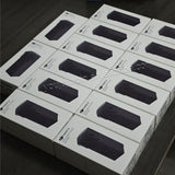 Set of boxed DJI 15.4V intelligent flight batteries with black battery window label