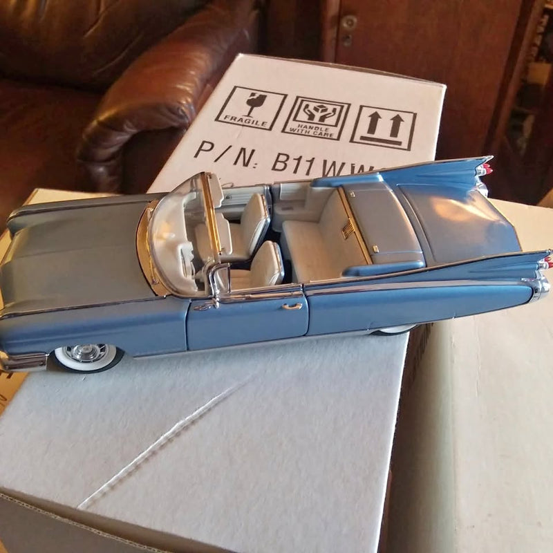 1:24 diecast convertible car, blue with chrome trim and light interior