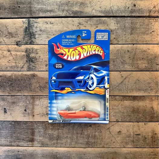 Hot Wheels diecast car in blister pack, blue and orange racing vehicle