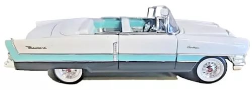 Vintage 1955 Packard Caribbean diecast car, white body with turquoise side stripe.