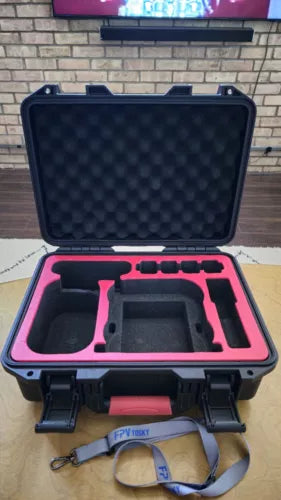 Hard drone case with open lid and molded foam interior, pink lining and carry handle