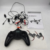 Quadcopter drone with red/black controller, wiring, propellers, and spare parts set