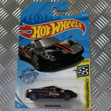 Black diecast sports car in blister card packaging
