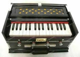 2.5-octave harmonium with 32-key keyboard and stop knobs, dark case