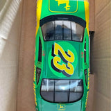 Diecast stock car front view, green body with yellow decals and grille details