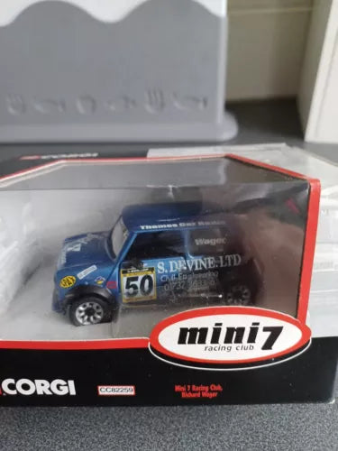 Diecast racing car toy in box, blue car with #56 on display, mini7 Racing Club label