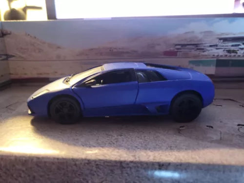 Matte blue Murcielago die-cast toy car, side view, 1:36 scale