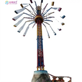 Amusement ride spinner tower with vertical frame and multiple dangling light fixtures