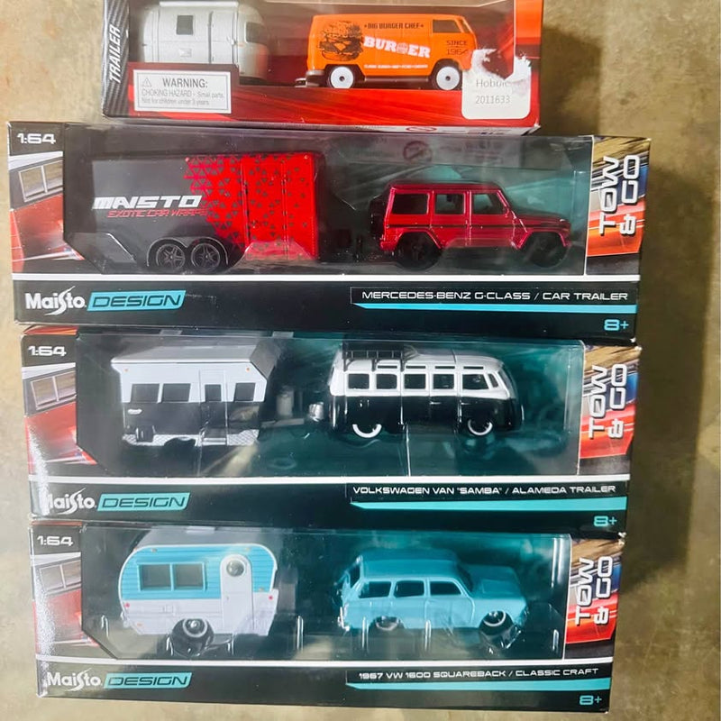 Set of 4 Maisto tow-and-go diecast cars in blister packaging, mixed red and blue trucks