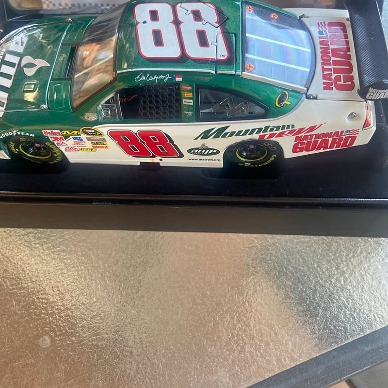 Green NASCAR diecast car with red 88 on hood and Mountain Guard graphics