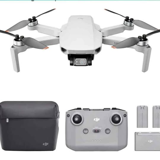 White foldable quadcopter drone with front camera, plus dark carry case and spare parts