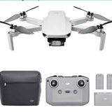 White foldable quadcopter drone with front camera, plus dark carry case and spare parts