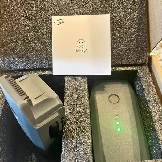 Gray rectangular drone battery pack with LED indicator and charging contacts