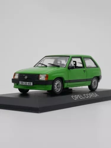 Green Opel Corsa diecast car model on display base, metal toy vehicle