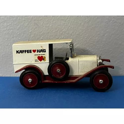 Cream diecast van with red wheels and Kaffee Hag logo on side