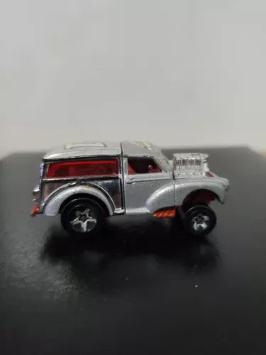 Silver vintage diecast toy car with red rear window, MG Rover style