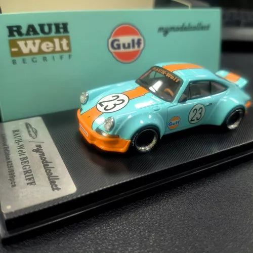 Turquoise and orange diecast model car with Gulf logo, front three-quarter view.