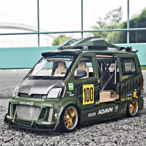 Diecast track sports car model, dark green with roll cage, front 3/4 view, yellow 100