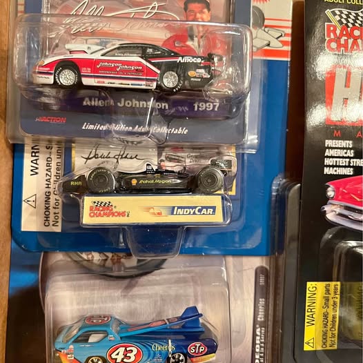 Diecast race car blister pack with blue #43 and red-and-white cars