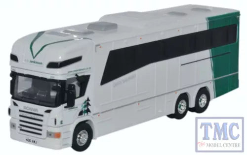 OO gauge horsebox model with white body and green accents, triple-axle trailer, front view