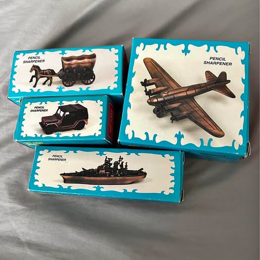 Diecast plane pencil sharpener set in teal boxes with aircraft images