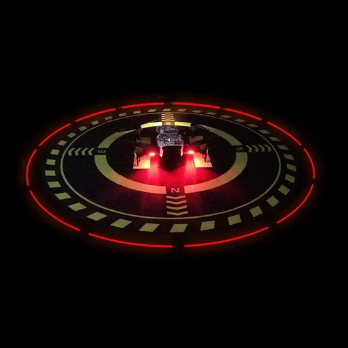 Foldable drone landing pad with red LED circular light and runway markings