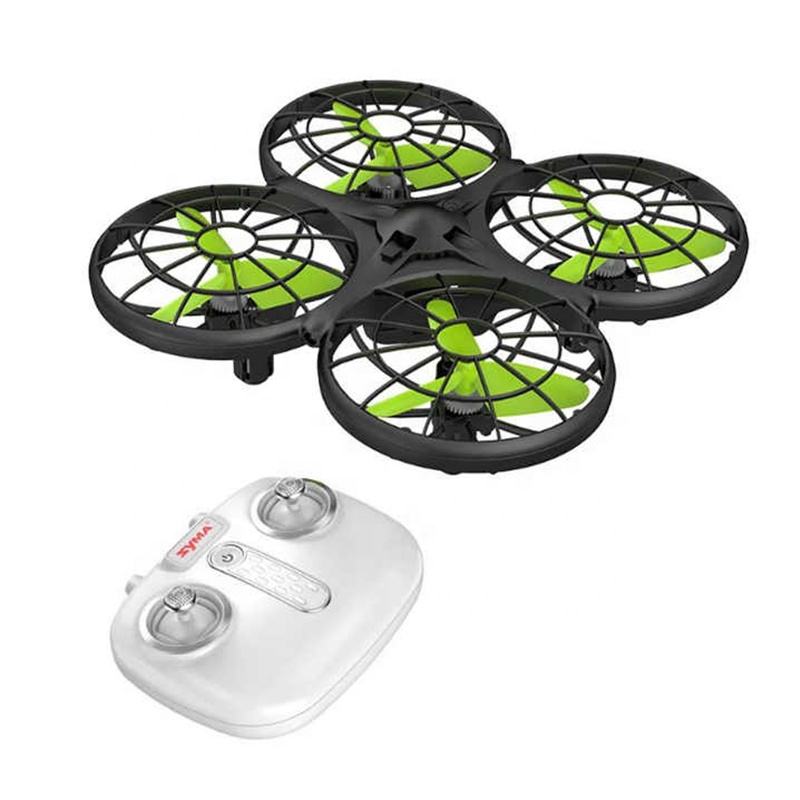 Mini quadcopter drone with four green propellers and UFO-style frame, with white remote controller