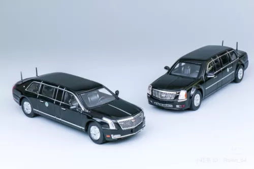 Diecast luxury limousine model car, dark green, front and side view