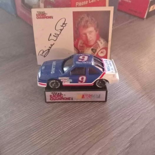 Bill Elliott #9 diecast race car, white with blue and red trim, front view.