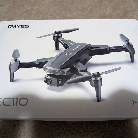 TMYES quadcopter drone with 4K camera, four rotors and front camera module, dark gray