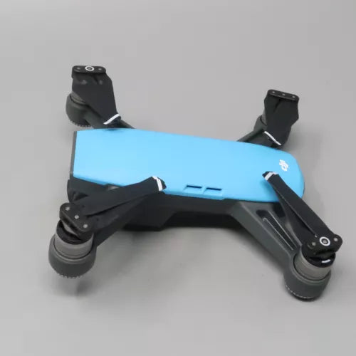 Blue quadcopter drone with stabilized 2-axis gimbal camera and four propellers
