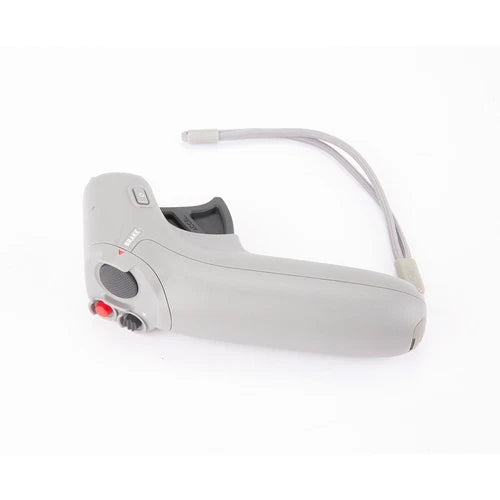 Gray handheld motion controller with wrist strap, cable, and trigger buttons