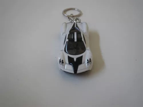 Diecast sports car keychain with white body, black hood, and metal keyring