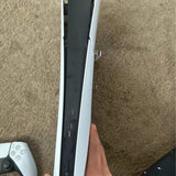 White PS5 Slim console side with ports and power/volume buttons