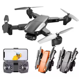 Folding quadcopter drone with four propellers, remote controller, and spare parts