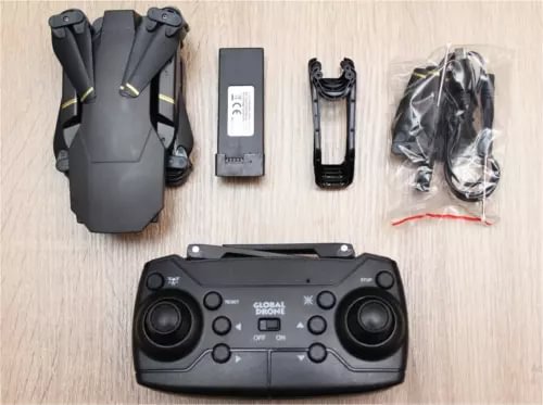 RC drone controller with phone mount, battery pack, cables, and protective parts