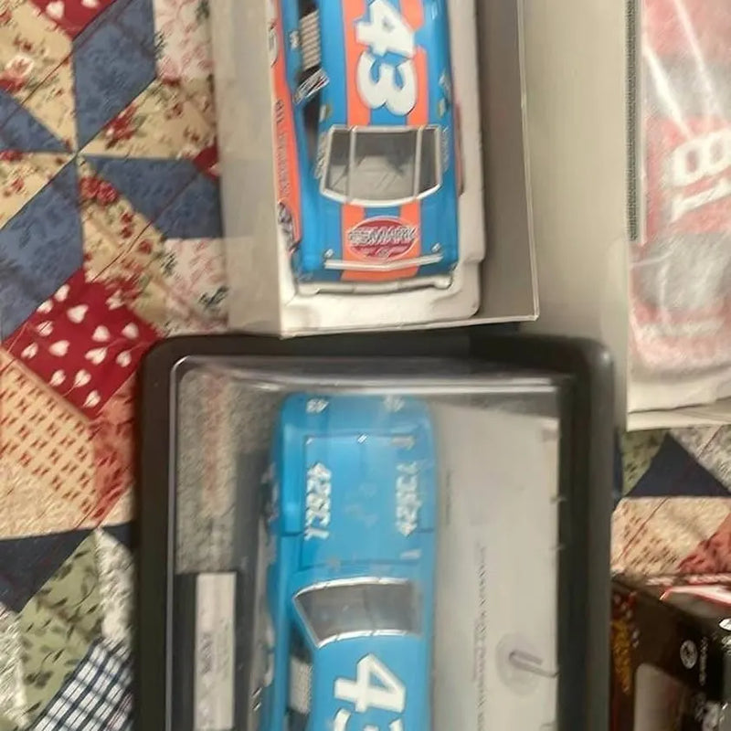 Nascar diecast race car in blue blister packaging