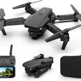Black foldable quadcopter drone with controller screen