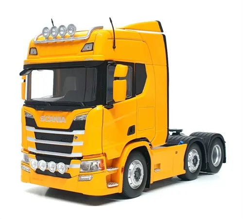 Yellow diecast semi truck cab with grille and headlights, Scania R500-style, 6x2