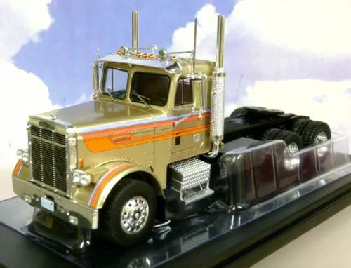 Green and orange Freightliner diecast truck cab, 1/43 scale, front-left view