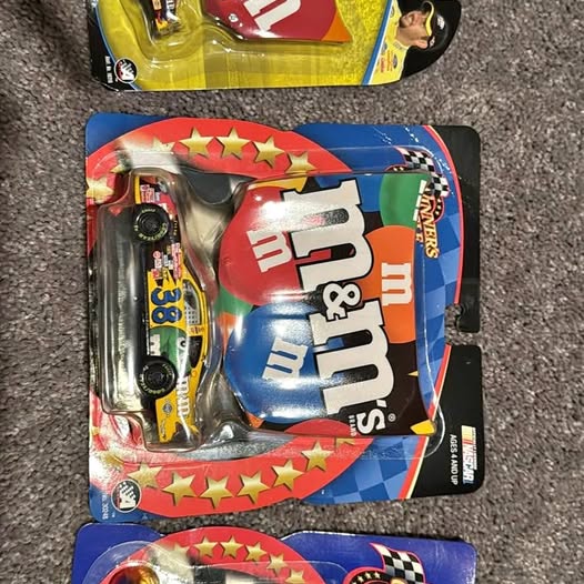 Race hood diecast car in blister pack, blue and red checkered design
